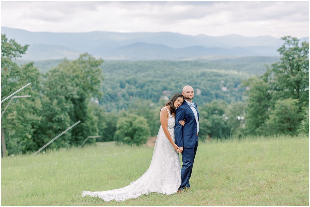 Virginia Wedding Bride and groom on top of a mountain  snuggling