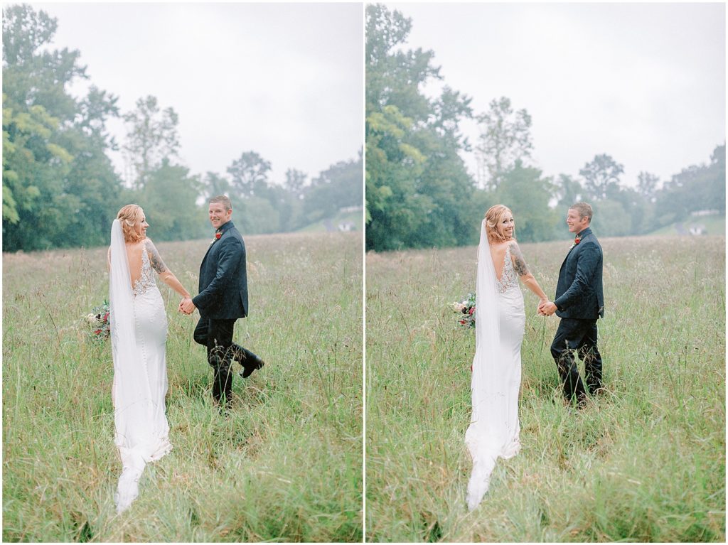 Rainy Virginia Wedding bride and groom walking in a field
