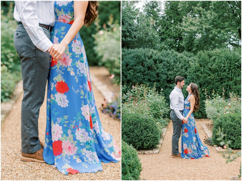 couple standing together holding hands in garden during engagement session